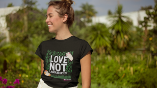 Woman wearing a black Cruelty Free International Love not Laboratories t-shirt