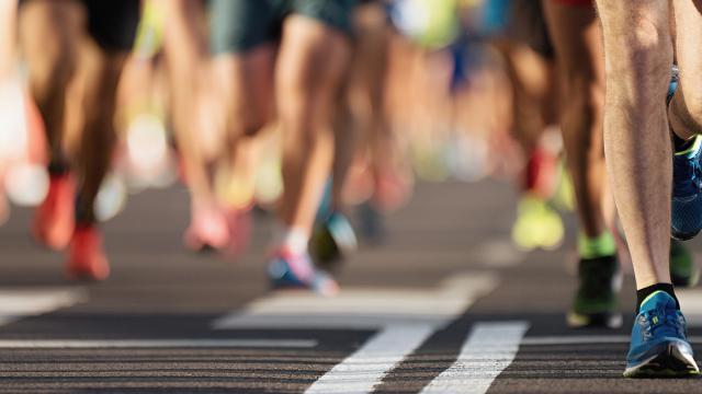 Close up of the legs of marathon runners